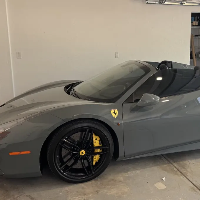Grey Ferrari 488 Spider freshly detailed in a client garage